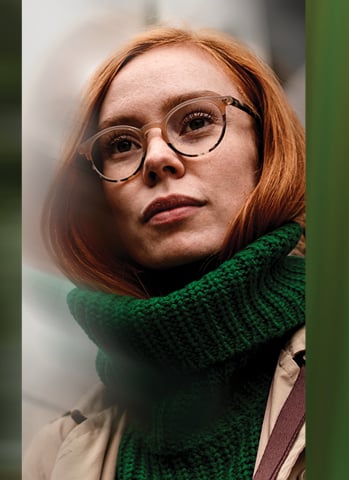 redheaded entrepreneur wearing a green scarf