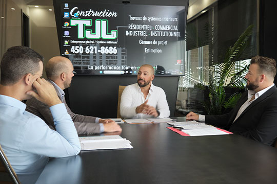 men from Construction TJL in team meeting